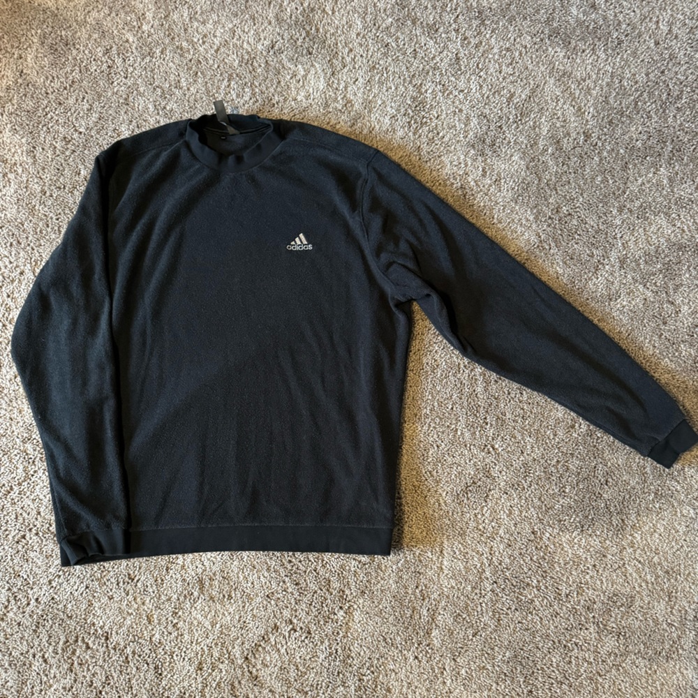 Adidas mock neck golf sweatshirt in black.